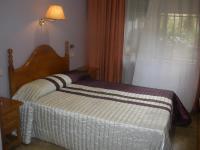 Posteľ alebo postele v izbe v ubytovaní Hotel Elena María