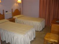 Posteľ alebo postele v izbe v ubytovaní Hotel Elena María