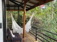 a hammock on the porch of a house at Oon Lee Bungalows in Ko Jum