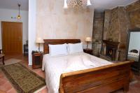 Postel nebo postele na pokoji v ubytování Archontiko Fiamegou Hotel&Spa