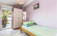 Posteľ alebo postele v izbe v ubytovaní Holiday Home Brela 55
