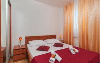 Postel nebo postele na pokoji v ubytování Apartment Supetar 43