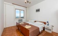 Posteľ alebo postele v izbe v ubytovaní Cozy Apartment In Pula With Kitchen