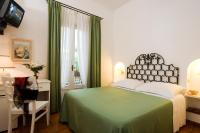 Postel nebo postele na pokoji v ubytování Hotel Villa Angelica