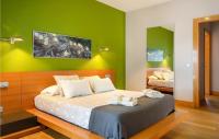 A bed or beds in a room at Nice Home In Playa Blanca With Sauna