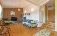 Telewizja i/lub zestaw kina domowego w obiekcie Holiday Home Betiga With Sea View Vi