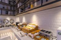a bakery with a bunch of donuts on display at Echarm Hotel Liudong Wuling Liuqi Of Liuzhou in Luorong