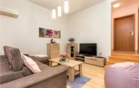 Telewizja i/lub zestaw kina domowego w obiekcie Holiday Home Peroj Lxxiii