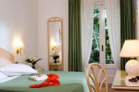Postel nebo postele na pokoji v ubytování Hotel Villa Angelica