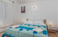 Posteľ alebo postele v izbe v ubytovaní Beautiful Apartment In Mali Losinj