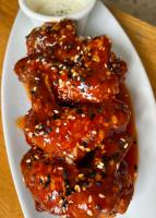 three pieces of food on a plate with sauce at Reef Hostel in Puerto Princesa City