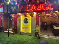 a store front with balloons and a sign on it at Lodge Babul in Kolkata