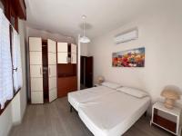 Postel nebo postele na pokoji v ubytování Residence Casa Pineta