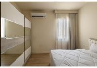 Postel nebo postele na pokoji v ubytování Apartment in Allegria Residence Compound - sheikh zayed