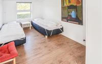 Postel nebo postele na pokoji v ubytování Holiday Home Harbokobbel