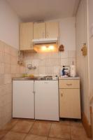 Kuchyň nebo kuchyňský kout v ubytování Apartments Mat