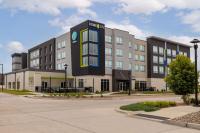 a large building with a sign on the front of it at Home2 Suites By Hilton Ankeny in Ankeny