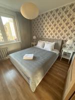 Posteľ alebo postele v izbe v ubytovaní Apartament Centrum