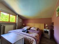 Posteľ alebo postele v izbe v ubytovaní Le Chalet Cosy piscine et spa