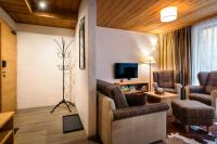 Televízia a/alebo spoločenská miestnosť v ubytovaní Apartman Konifer - Jacuzzi - Ski In Ski Out