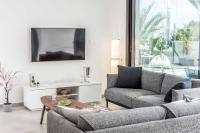 TV a/nebo společenská místnost v ubytování By The Bay 32