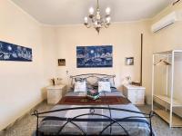 A bed or beds in a room at Attico Talenti