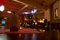 a table in a restaurant with a table cloth on it at Pindeck in Bad Oldesloe