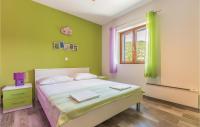 Posteľ alebo postele v izbe v ubytovaní Six-Bedroom Holiday Home In Zagvozd