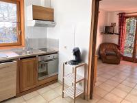 Kuchnia lub aneks kuchenny w obiekcie Appartement cosy aux Sybelles, grand extérieur, garage privé, proche pistes, parfait pour familles - FR-1-267-246