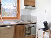 Kuchnia lub aneks kuchenny w obiekcie Appartement cosy aux Sybelles, grand extérieur, garage privé, proche pistes, parfait pour familles - FR-1-267-246