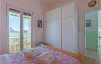 Postel nebo postele na pokoji v ubytování Two-Bedroom Holiday Home In Betiga