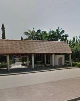 a building with a roof on the side of a road at De-Boss Comfort Homes in Abuja