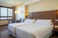 A bed or beds in a room at Hotel Coia de Vigo