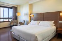 A bed or beds in a room at Hotel Coia de Vigo