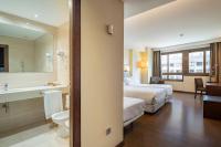 A bed or beds in a room at Hotel Coia de Vigo