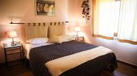A bed or beds in a room at Agriturismo Il Quarto