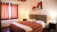 A bed or beds in a room at Agriturismo Il Quarto