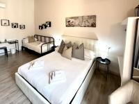A bed or beds in a room at San Pietro Rooms 84