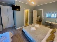 A bed or beds in a room at San Pietro Rooms 84
