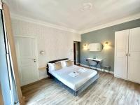 A bed or beds in a room at San Pietro Rooms 84
