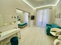 A television and/or entertainment centre at San Pietro Rooms 84