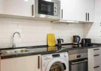 Kuchyňa alebo kuchynka v ubytovaní Apartamento Pink Puerto