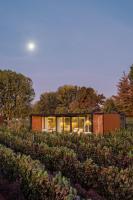 a house in the middle of a garden at Vibo Wine Lodge At Viu Manent in Santa Cruz