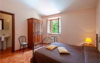 A bed or beds in a room at Valguerriera - Rosa Bianca
