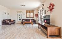 A television and/or entertainment centre at Amazing Home In Kokari