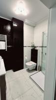 Kúpeľňa v ubytovaní Apartament Black-White
