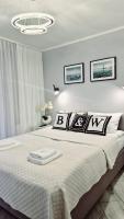 Posteľ alebo postele v izbe v ubytovaní Apartament Black-White