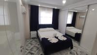Postel nebo postele na pokoji v ubytování Engin HOME