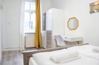 A bed or beds in a room at Delightful 2BR Apt.-Near Wiener Stadthalle
