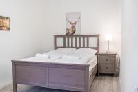 A bed or beds in a room at Delightful 2BR Apt.-Near Wiener Stadthalle